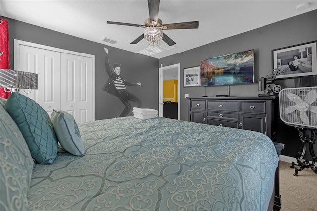 carpeted bedroom featuring a closet and ceiling fan