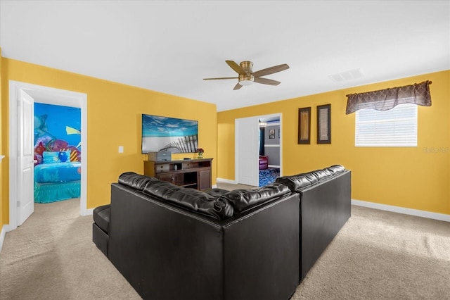 living room with light colored carpet and ceiling fan