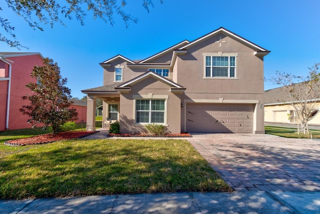 view of front of house featuring a garage and a front yard