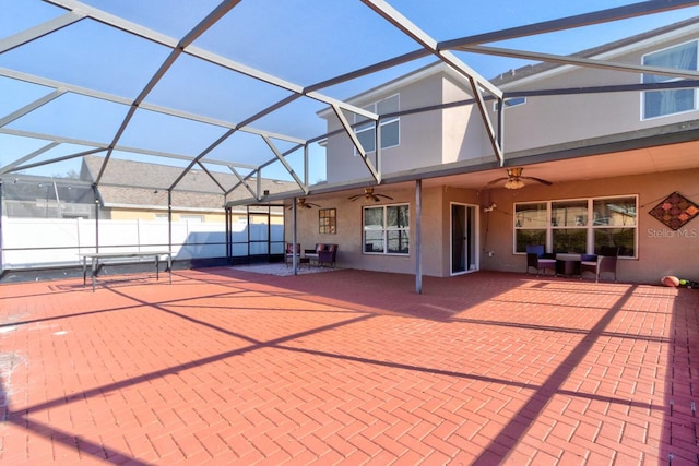 exterior space with a lanai, ceiling fan, and a patio