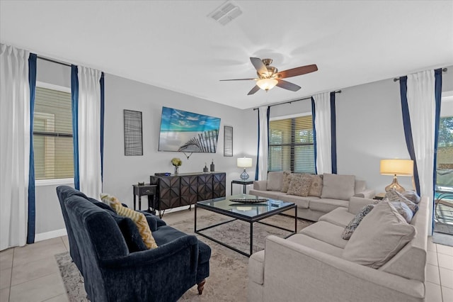 living room featuring light tile patterned floors and ceiling fan