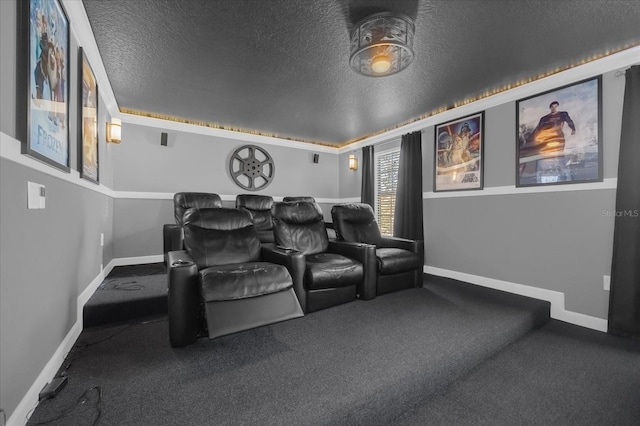 carpeted home theater room featuring a textured ceiling