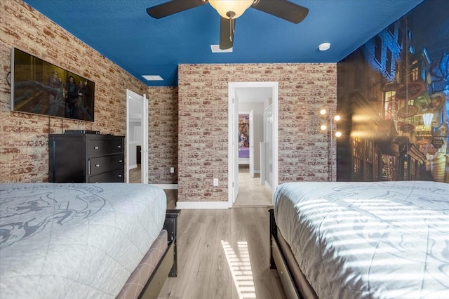 bedroom featuring ceiling fan and wood-type flooring