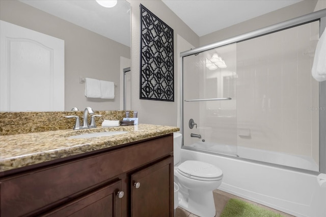 full bathroom with vanity, toilet, and enclosed tub / shower combo