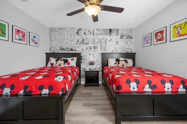 bedroom featuring hardwood / wood-style flooring and ceiling fan