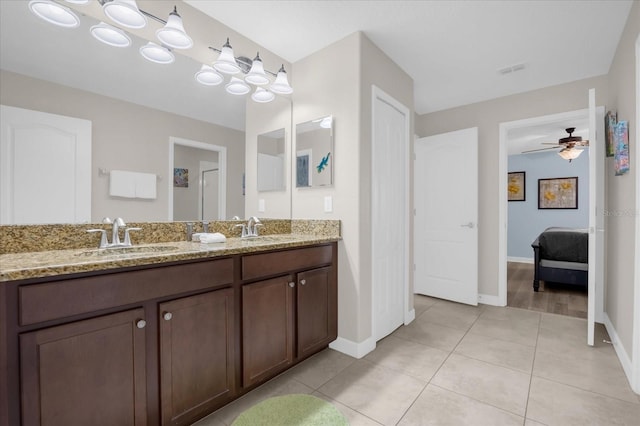 bathroom featuring tile patterned flooring, ceiling fan, and vanity