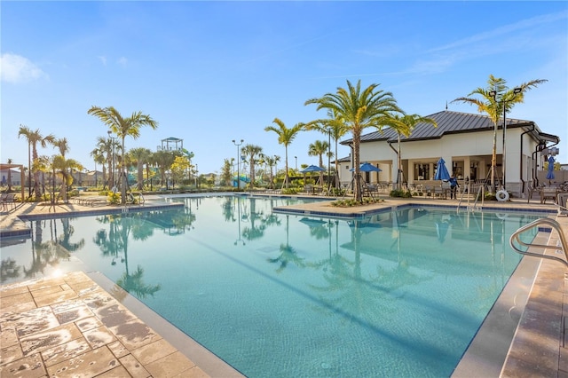 view of swimming pool with a patio