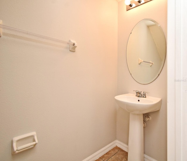 bathroom with tile patterned floors