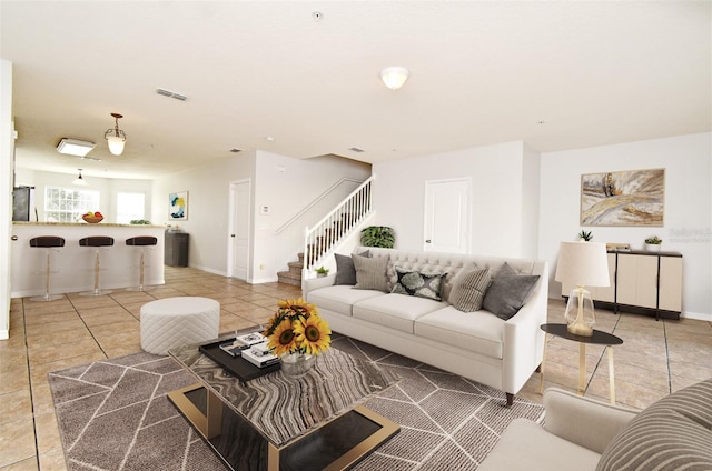 living room with tile patterned flooring