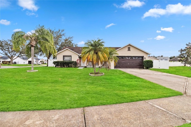 single story home featuring a front yard and a garage