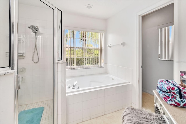 bathroom with tile patterned floors and plus walk in shower