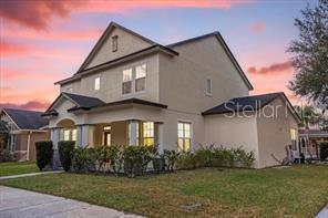 property exterior at dusk with a yard