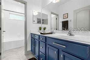 bathroom featuring shower / bathing tub combination and vanity