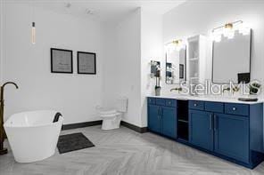 bathroom with vanity and a bath