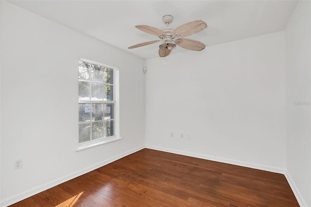 spare room with ceiling fan and wood-type flooring