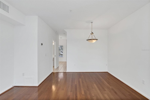 unfurnished room featuring light wood-type flooring