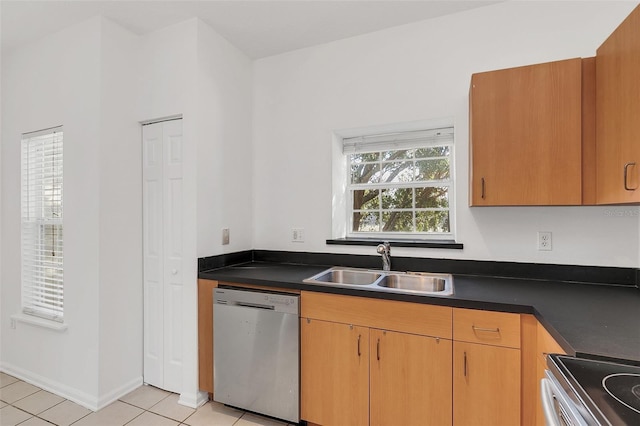 kitchen featuring light tile patterned flooring, appliances with stainless steel finishes, and sink