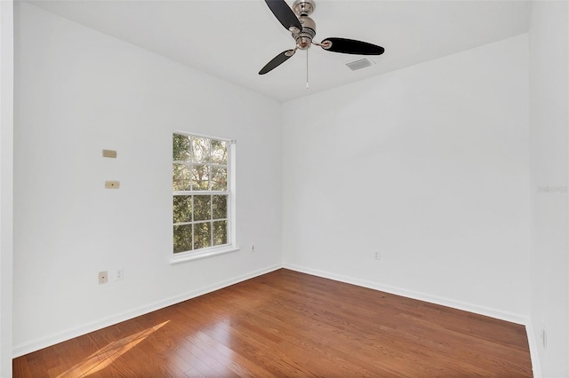 unfurnished room featuring hardwood / wood-style floors and ceiling fan