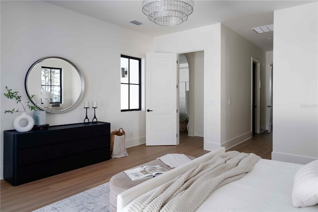 bedroom featuring hardwood / wood-style flooring