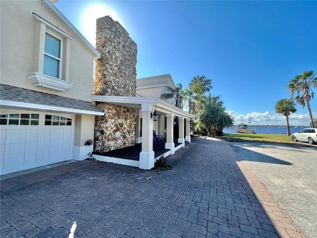 exterior space with a water view