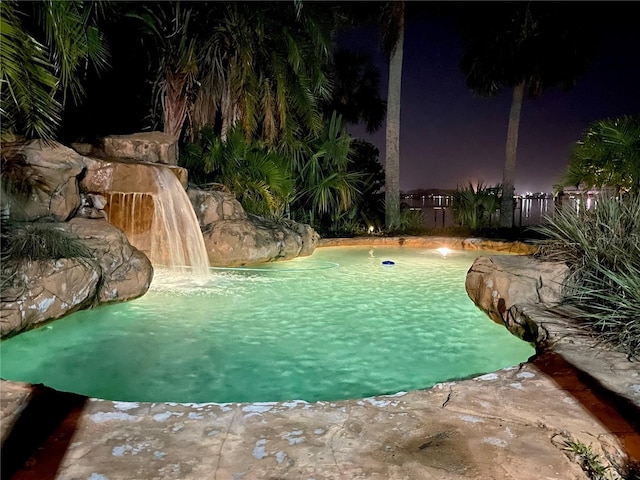 view of pool with pool water feature