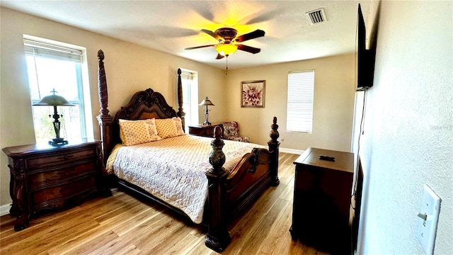 bedroom with light wood-type flooring and ceiling fan