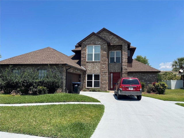 view of front of home featuring a garage, brick siding, concrete driveway, and a front lawn