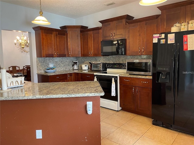 kitchen with visible vents, decorative backsplash, black appliances, pendant lighting, and a textured ceiling