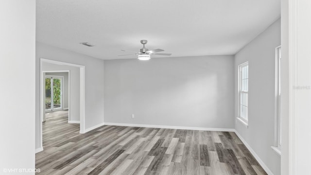 unfurnished room featuring ceiling fan and light wood-type flooring