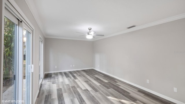 unfurnished room featuring hardwood / wood-style flooring, ceiling fan, and ornamental molding