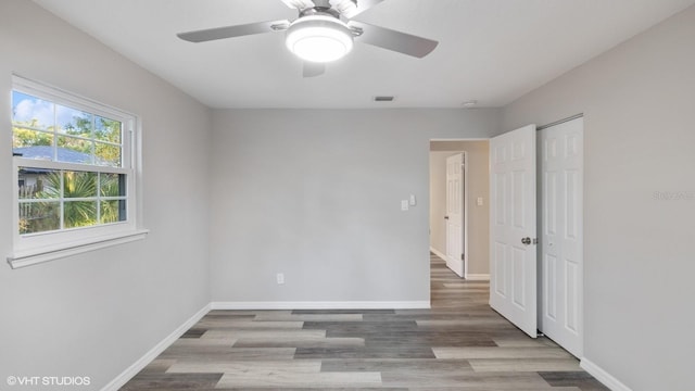 spare room featuring light hardwood / wood-style floors and ceiling fan