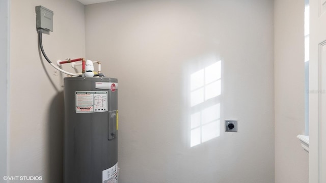 utility room with electric water heater