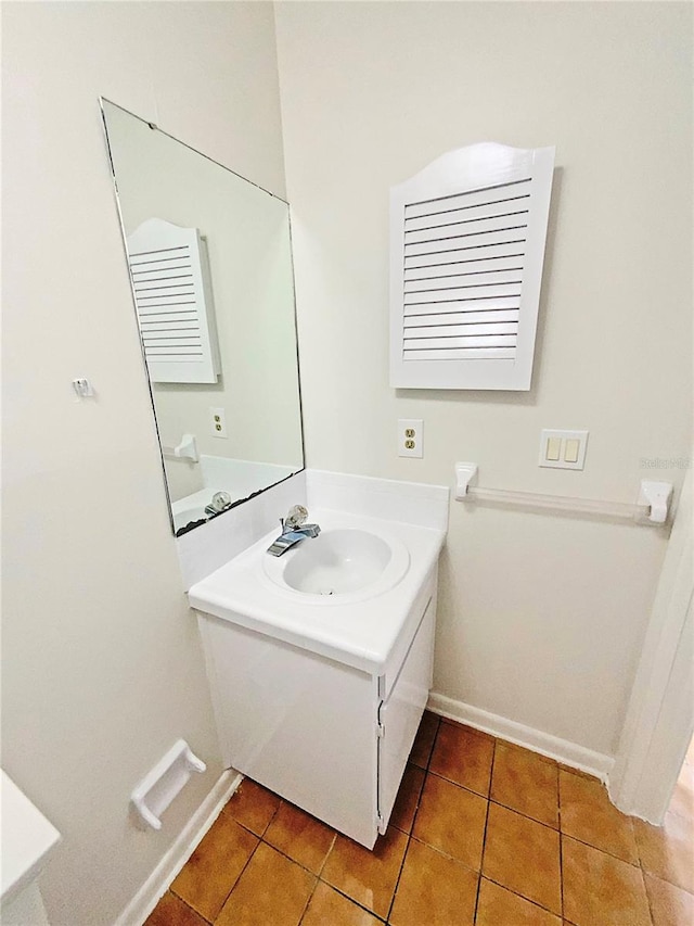 bathroom featuring tile patterned flooring and vanity