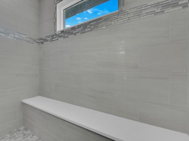 interior space featuring tiled shower