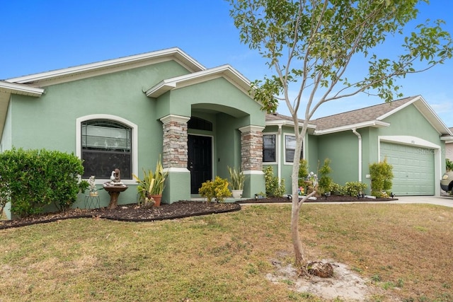 ranch-style home with a garage and a front lawn