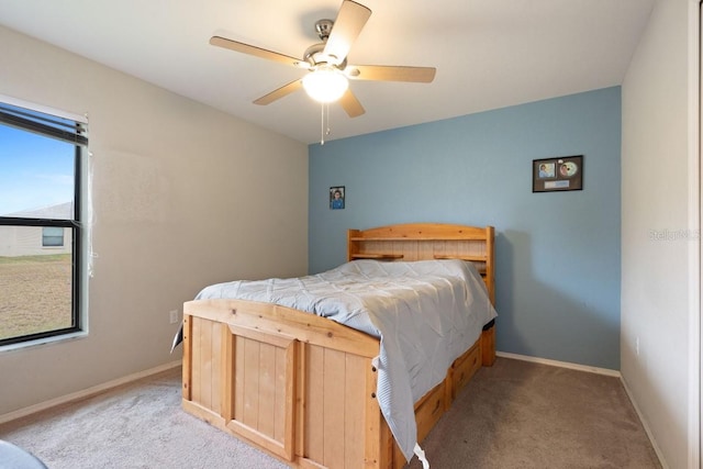 bedroom featuring ceiling fan and light carpet