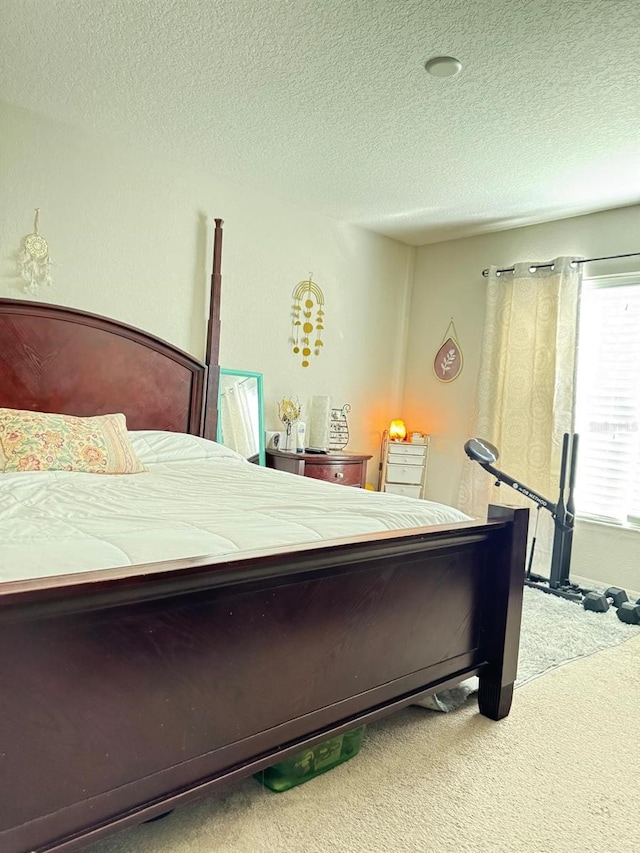 carpeted bedroom with a textured ceiling