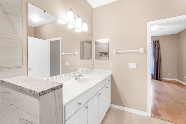 bathroom featuring tile patterned flooring and vanity