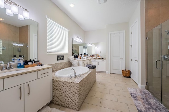 bathroom with tile patterned flooring, vanity, and independent shower and bath