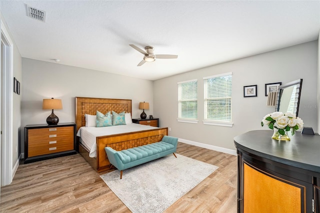 bedroom featuring hardwood / wood-style flooring and ceiling fan