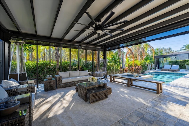 view of patio / terrace featuring a fenced in pool, ceiling fan, and an outdoor hangout area