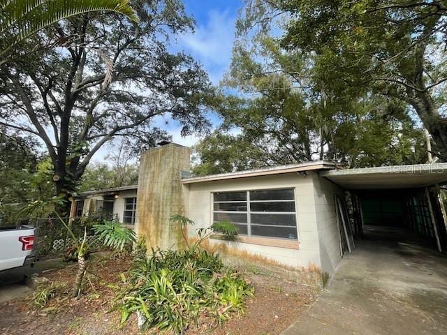 view of home's exterior featuring a carport