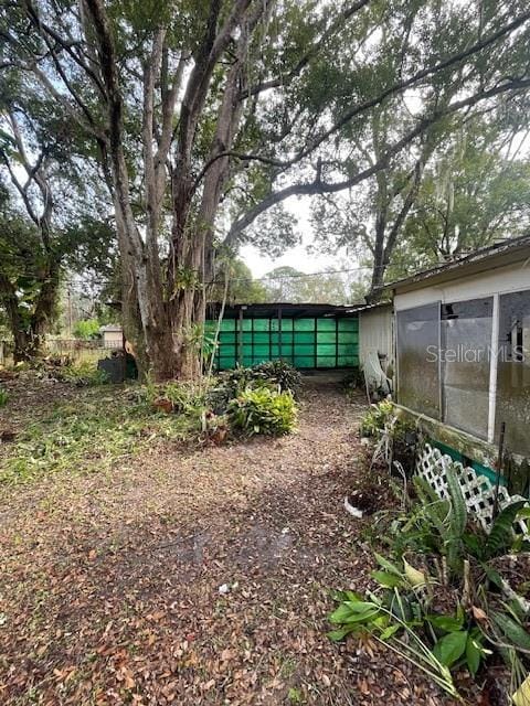 view of yard with a sunroom