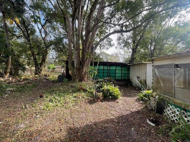 view of yard featuring a sunroom