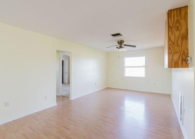 unfurnished room featuring ceiling fan and light hardwood / wood-style floors