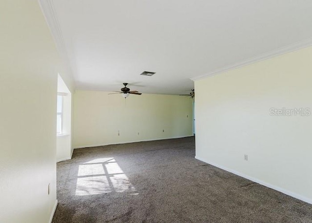 spare room featuring carpet flooring, ceiling fan, and ornamental molding