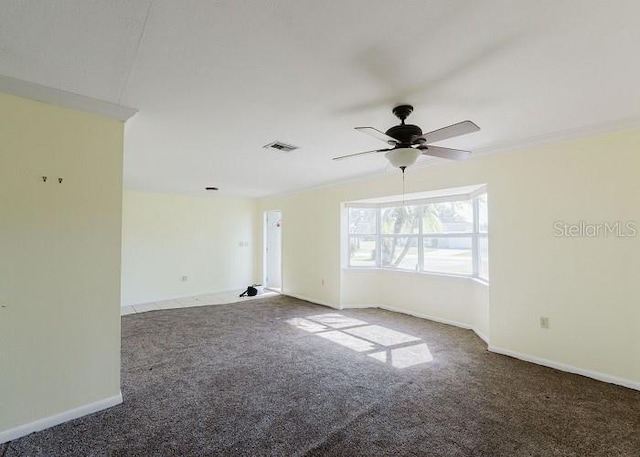 unfurnished room featuring ceiling fan, carpet floors, and vaulted ceiling