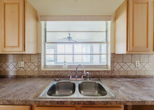 kitchen with ceiling fan, light brown cabinets, sink, and tasteful backsplash