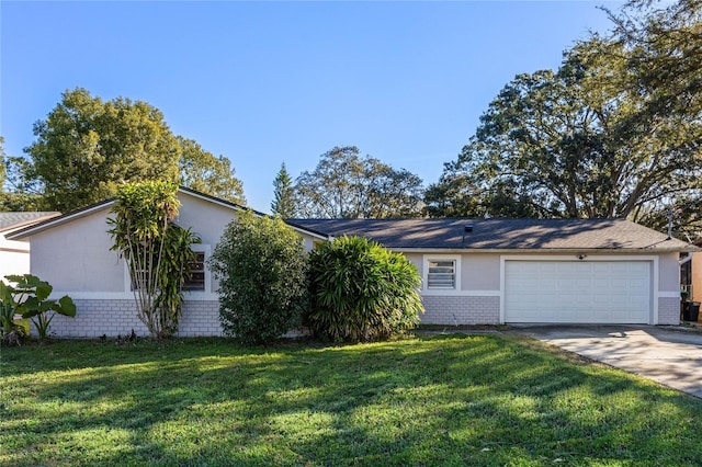 single story home featuring a garage and a front lawn