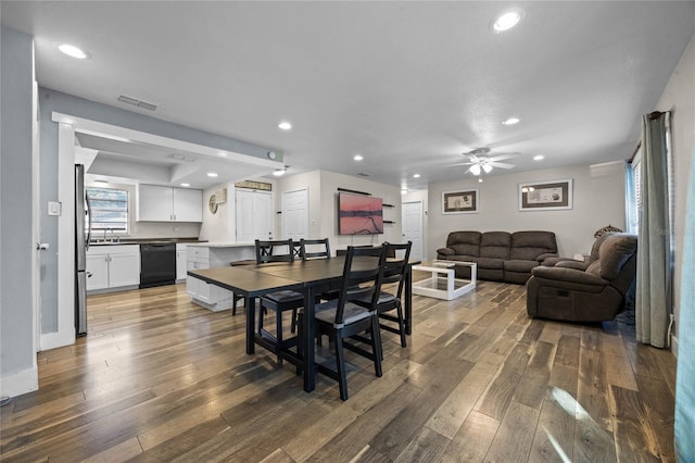 dining area featuring ceiling fan and dark hardwood / wood-style floors